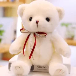 Ours en peluche blanc noeud rouge
