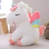 Peluche licorne avec des ailes